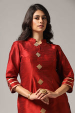 Load image into Gallery viewer, Maroon raw silk sharara set adorned with multi-color resham embroidery, paired with a match net dupatta