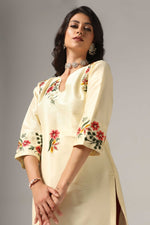 Load image into Gallery viewer, Creme raw silk embroidered kurti paired with pants and a net maching dupatta.