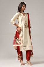 Load image into Gallery viewer, Creme raw silk embroidered kurti paired with pants and a net maching dupatta.