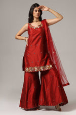 Load image into Gallery viewer, Maroon raw silk sharara set adorned with multi-color resham embroidery, paired with a match net dupatta