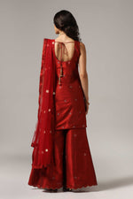 Load image into Gallery viewer, Maroon raw silk sharara set adorned with multi-color resham embroidery, paired with a match net dupatta