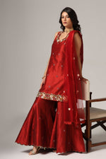 Load image into Gallery viewer, Maroon raw silk sharara set adorned with multi-color resham embroidery, paired with a match net dupatta