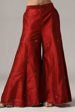 Load image into Gallery viewer, Maroon raw silk sharara set adorned with multi-color resham embroidery, paired with a match net dupatta