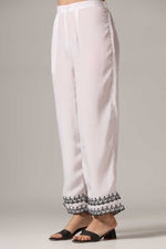 Load image into Gallery viewer, White french crepe resham embroidered kurti paired with pants and a net dupatta