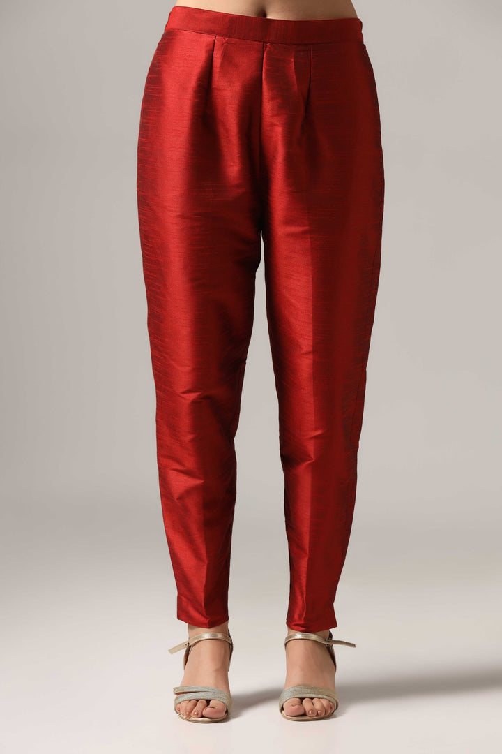 Maroon raw silk kurti paired with pants and a matching net dupatta