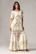 Load image into Gallery viewer, Cream-colored French crepe sharara set with multi-color resham embroidery with net dupatta
