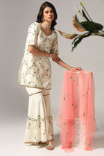 Load image into Gallery viewer, Cream-colored French crepe sharara set with multi-color resham embroidery with net dupatta
