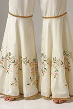 Load image into Gallery viewer, Cream-colored French crepe sharara set with multi-color resham embroidery with net dupatta
