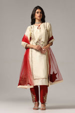 Load image into Gallery viewer, Creme raw silk embroidered kurti paired with pants and a net maching dupatta.
