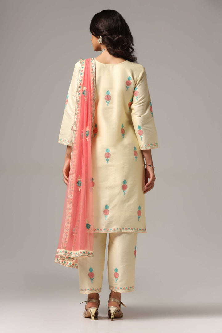 Creme raw silk ari embroidered kurti paired with pants and a net maching dupatta
