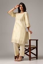 Load image into Gallery viewer, Creme raw silk gold zari embroidered &amp; hand crafted with sequence kurti paired with pants and a net dupatta
