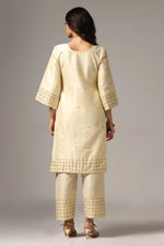 Load image into Gallery viewer, Creme raw silk gold zari embroidered &amp; hand crafted with sequence kurti paired with pants and a net dupatta
