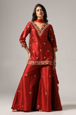 Load image into Gallery viewer, Maroon raw silk sharara set adorned with multi-color resham embroidery, paired with a match net dupatta
