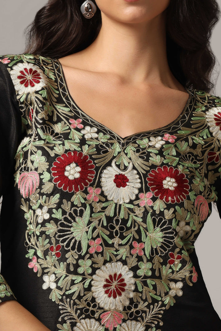 Black raw silk resham embroidered kurti paired with pants and a net maching dupatta
