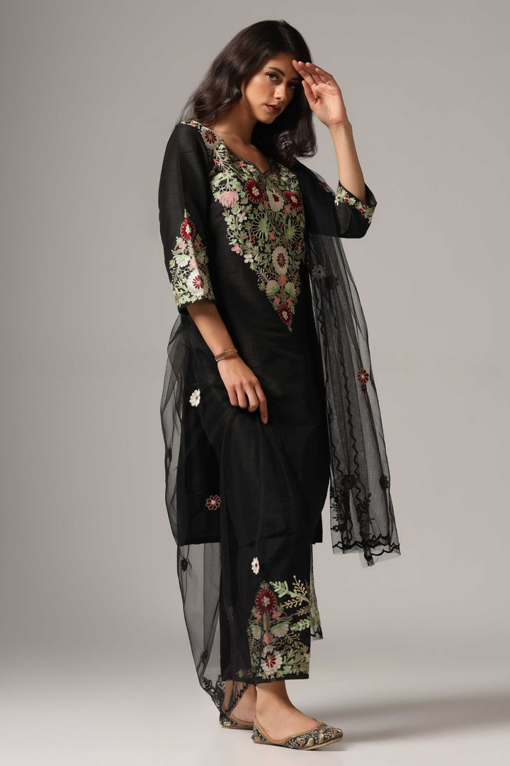 Black raw silk resham embroidered kurti paired with pants and a net maching dupatta