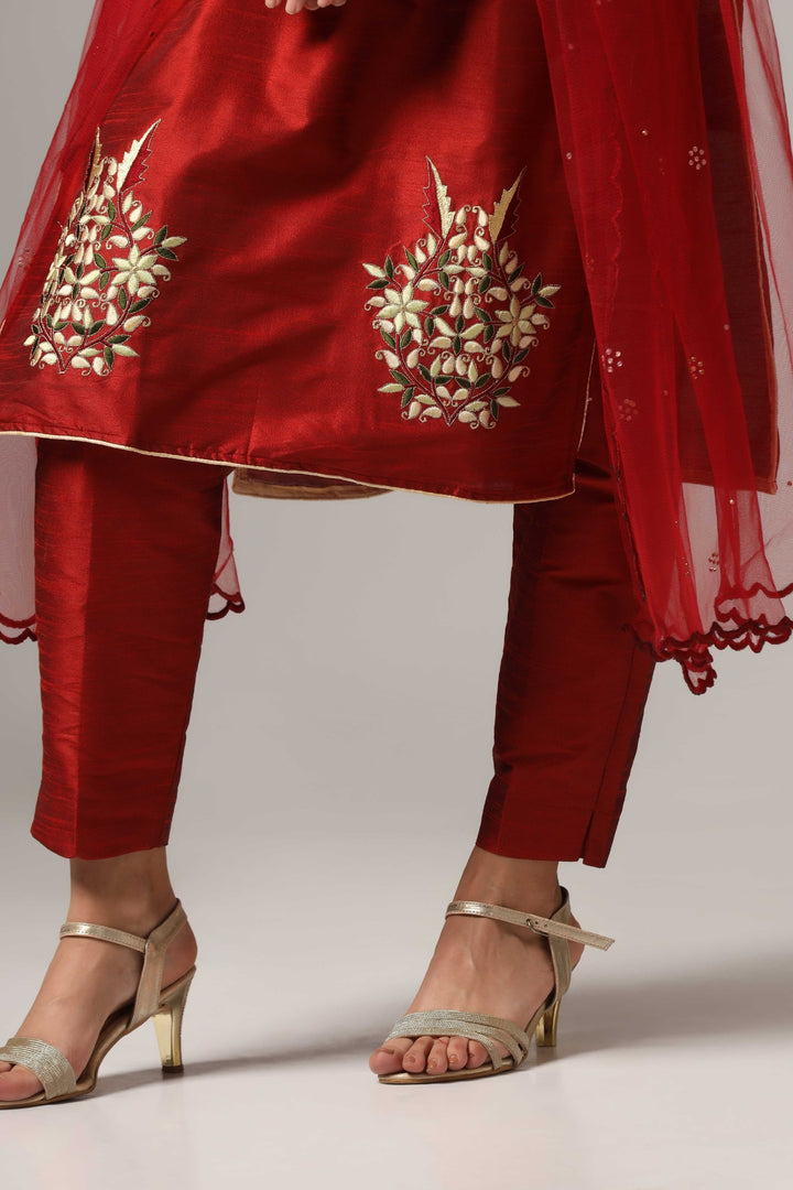 Maroon raw silk resham embroidered kurti paired with pants and a net dupatta