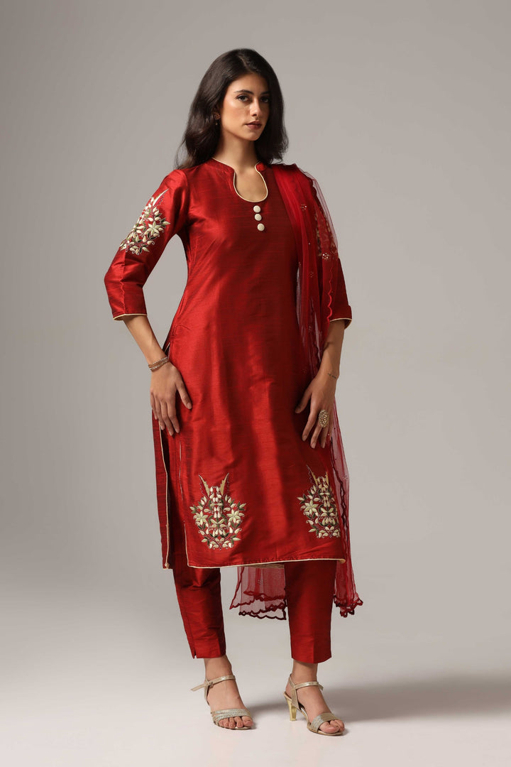 Maroon raw silk resham embroidered kurti paired with pants and a net dupatta