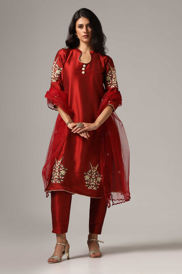 Maroon raw silk resham embroidered kurti paired with pants and a net dupatta