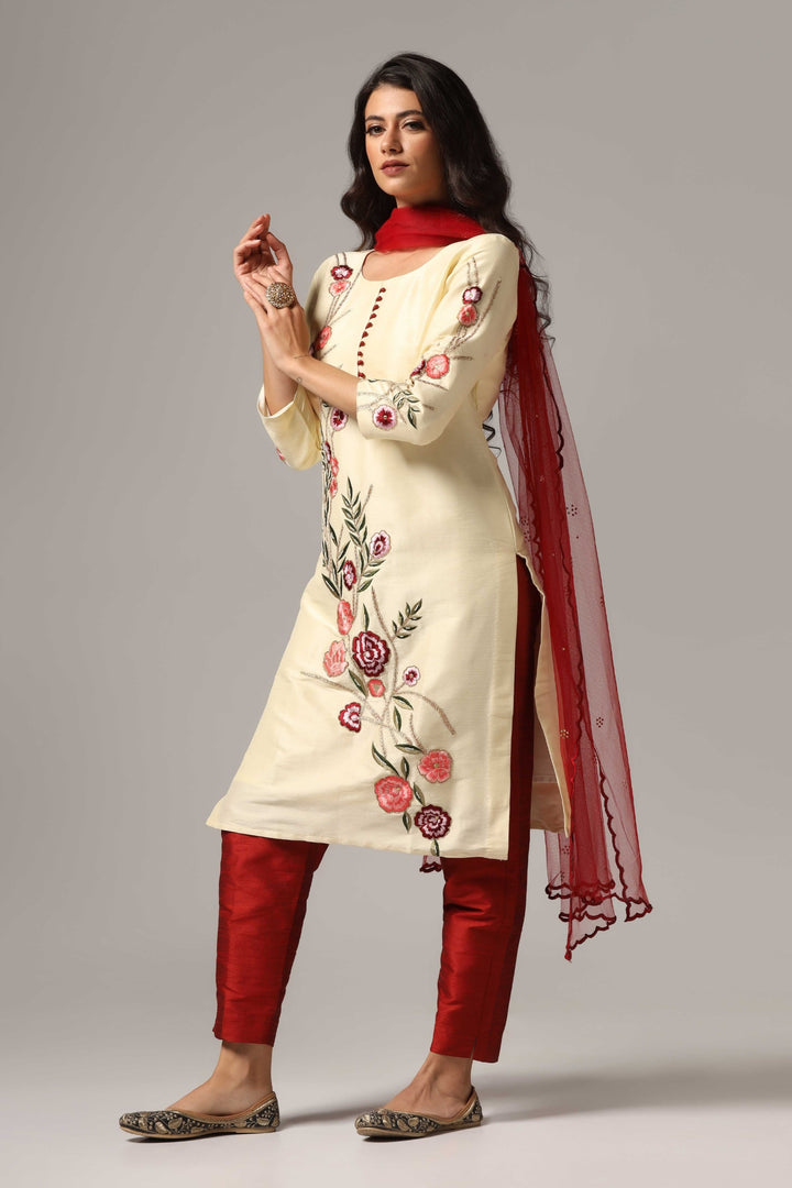 Creme raw silk resham embroidered kurti paired with pants and a net dupatta