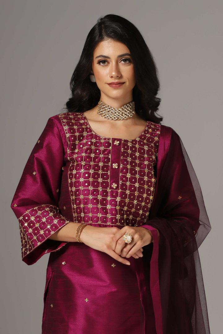 Purple raw silk gold zari embroidered & hand crafted with sequence kurti paired with pants and a net dupatta